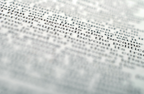 Blurred image containing text.